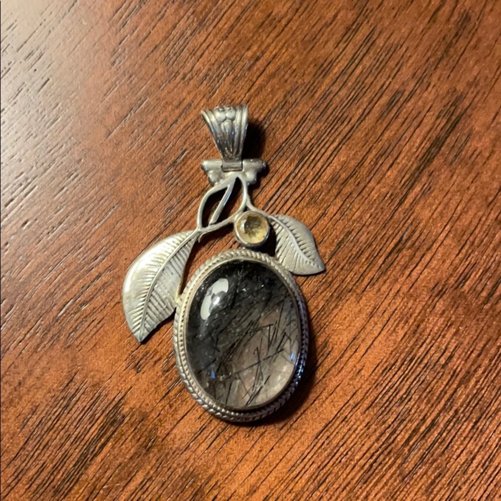 Tourmilated quartz pendant with silver leaves